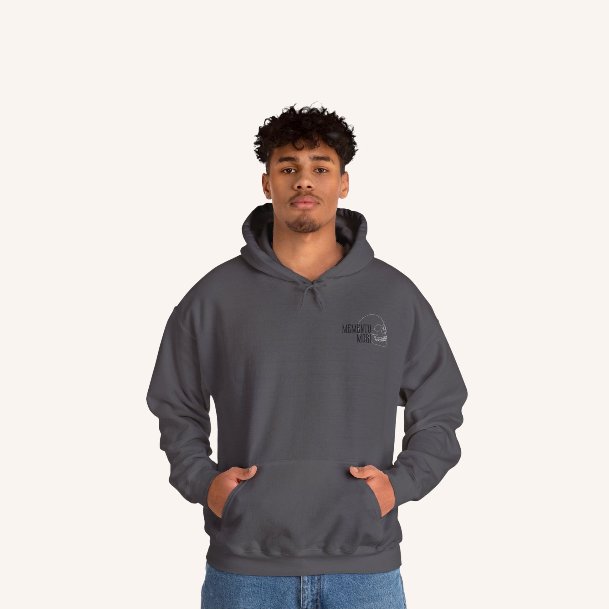 a man wearing a grey hoodie with the north face logo on it