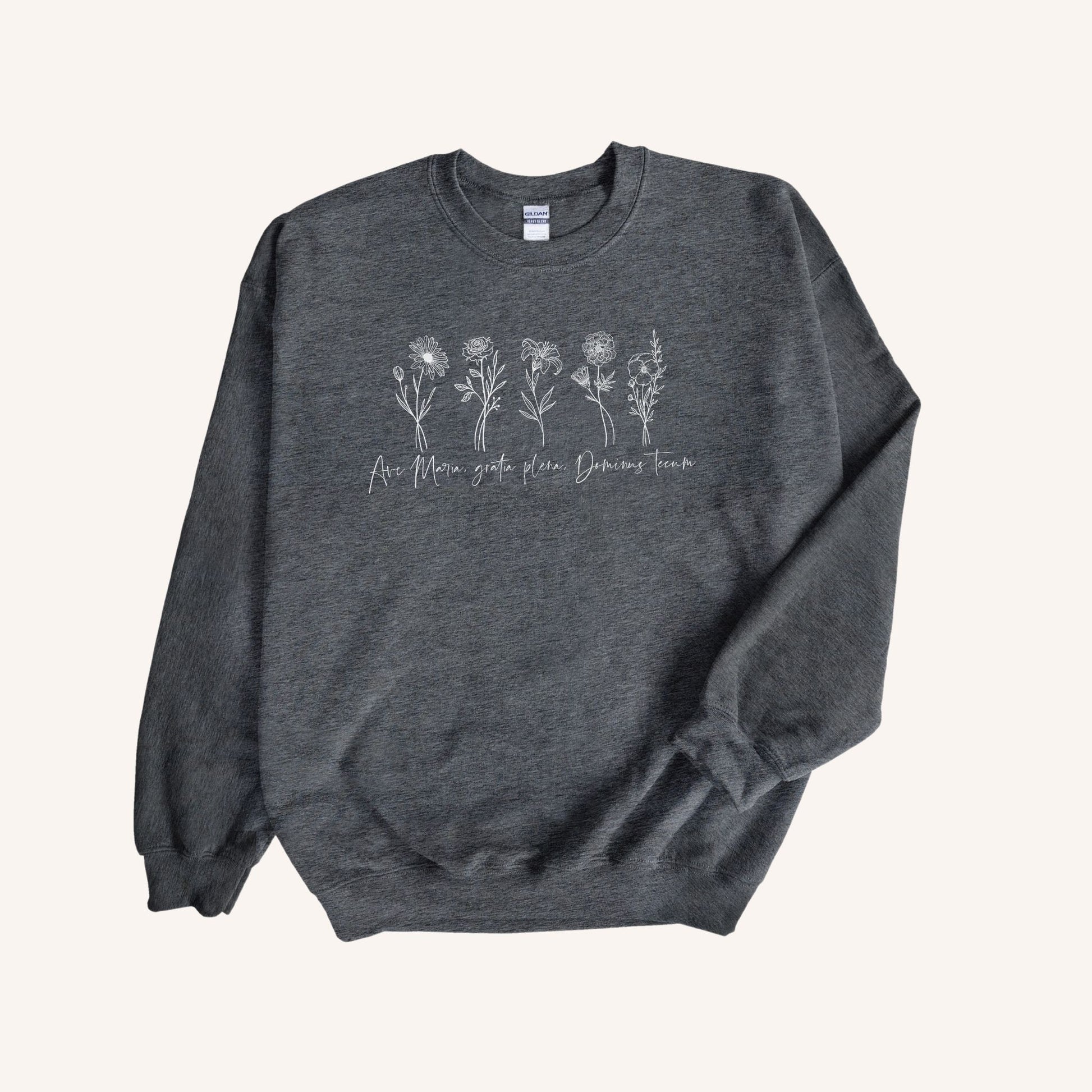 a gray sweatshirt with three flowers on it