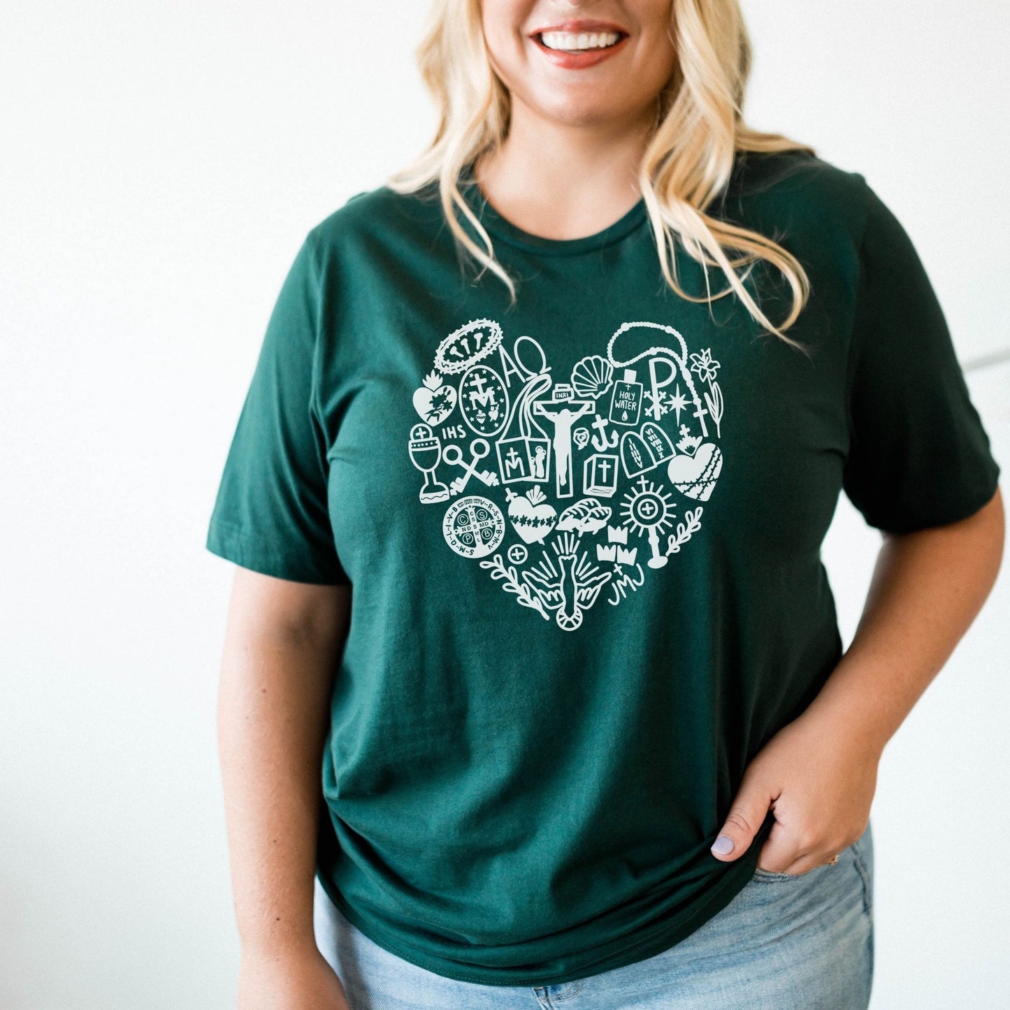 a woman wearing a green heart shaped t - shirt