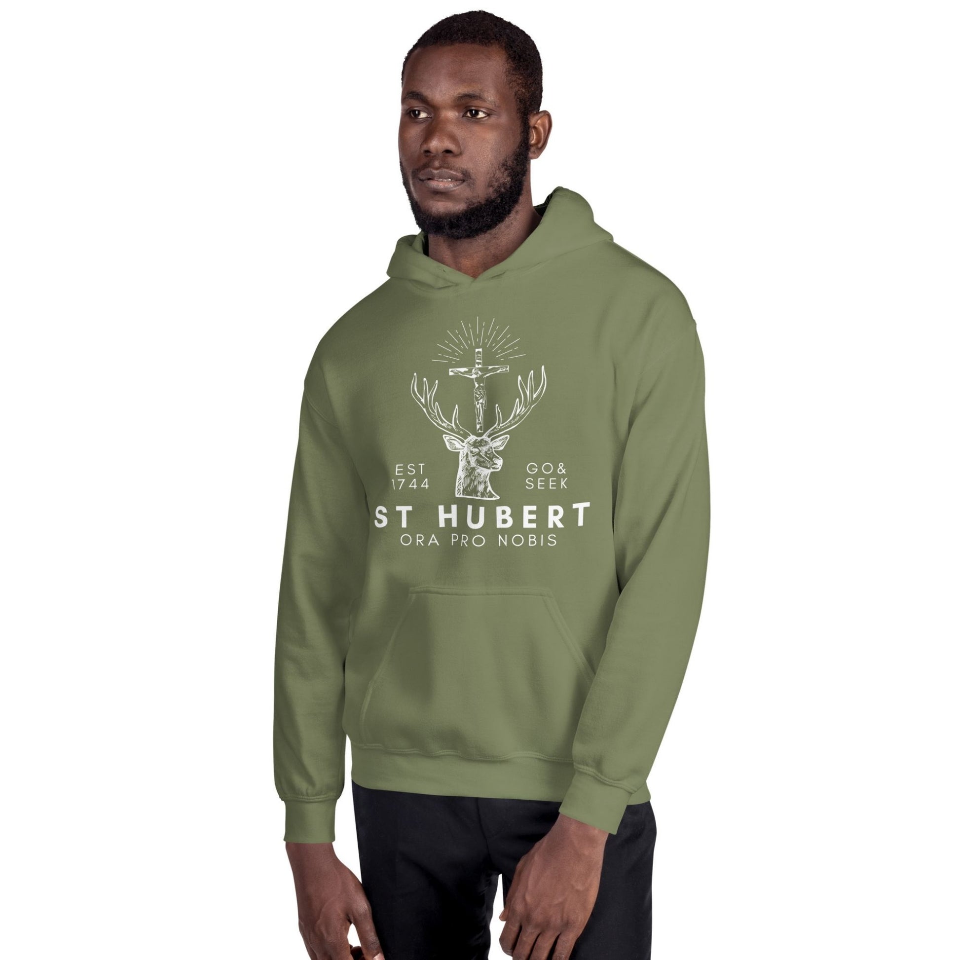 a man wearing a green hoodie that says st hubbert